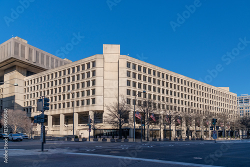 The J. Edgar Hoover FBI Building in Washington, D.C., was photographed on a clear day. Its brutalist architecture symbolizes federal law enforcement, governance, and national security. photo