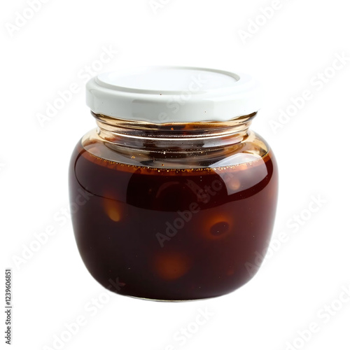 Close-up of a glass jar filled with dark-colored marinated olives, sealed with a white lid. photo