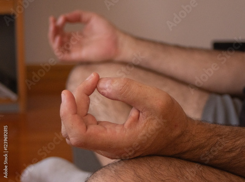 Closeup of man's hands meditating indoors.Yoga, relax and meditate concept. photo
