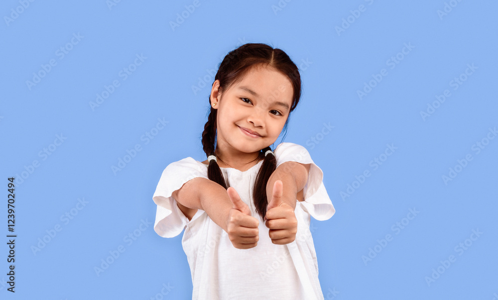 I Like It. Positive Japanese Kid Girl Gesturing Thumbs Up Standing Over Purple Background In Studio I Like It. Positive Japanese Kid Girl Gesturing Thumbs Up Standing Over Purple Background In Studio