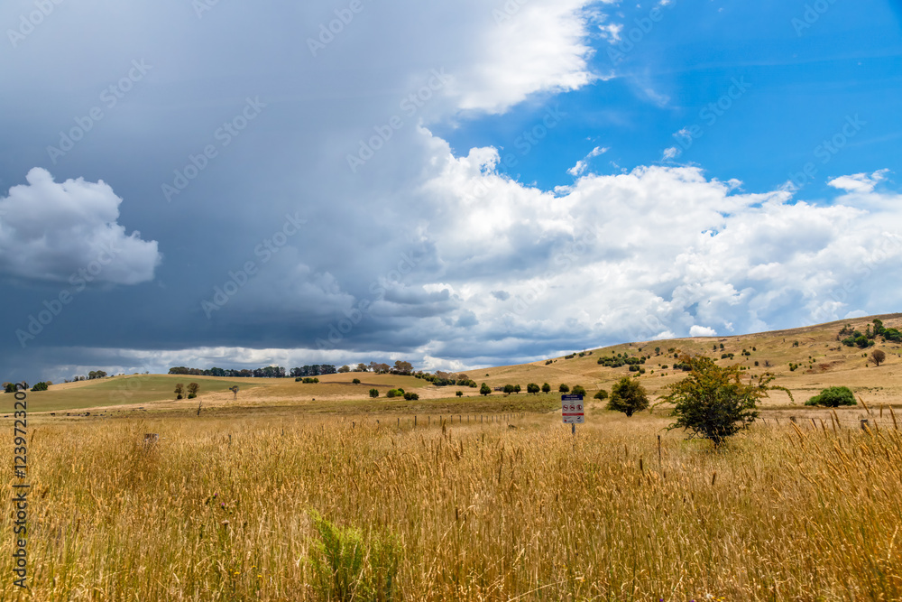 Obraz premium Countryside and storm clouds with blue sky
