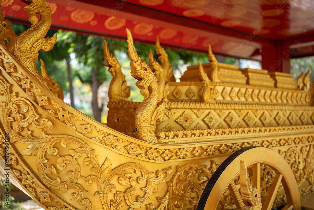 Fototapeta premium A majestic golden carriage, adorned with intricate carvings and dragon accents, commands attention.