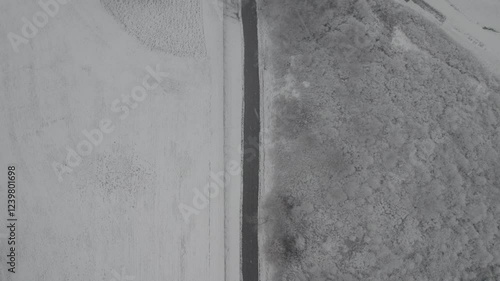 Flying over a road with snow