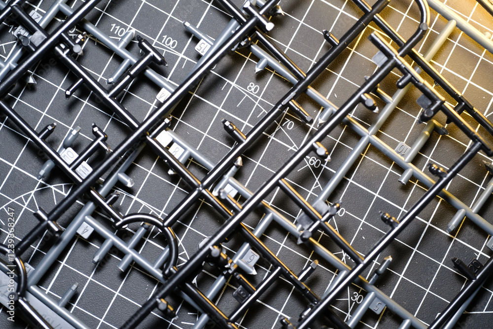 Abstract Backgrounds of Black Plastic Frame for Model Kit. Plastic model kit frame with black cutting mat background with striped pattern. Building Robot Model Kit. Toys and Hobbies Abstract Backgrounds of Black Plastic Frame for Model Kit. Plastic model kit frame with black cutting mat background with striped pattern. Building Robot Model Kit. Toys and Hobbies