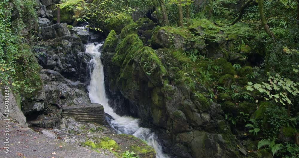 Wide shot of a waterfall on the river sychryd at Coed-Y-Rhaidyr, Pontneddfechan, Neath, Wide shot of a waterfall on the river sychryd at Coed-Y-Rhaidyr, Pontneddfechan, Neath,