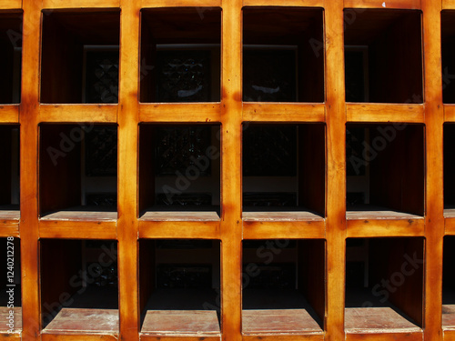 Square pattern of wooden shoe rack.