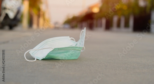 Higienic mask on floor. Disposable hygienic mask. Conceptual hygiene photo