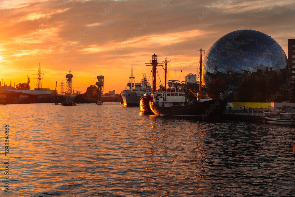 Pregolya River and ships in Kaliningrad at sunset. Russia