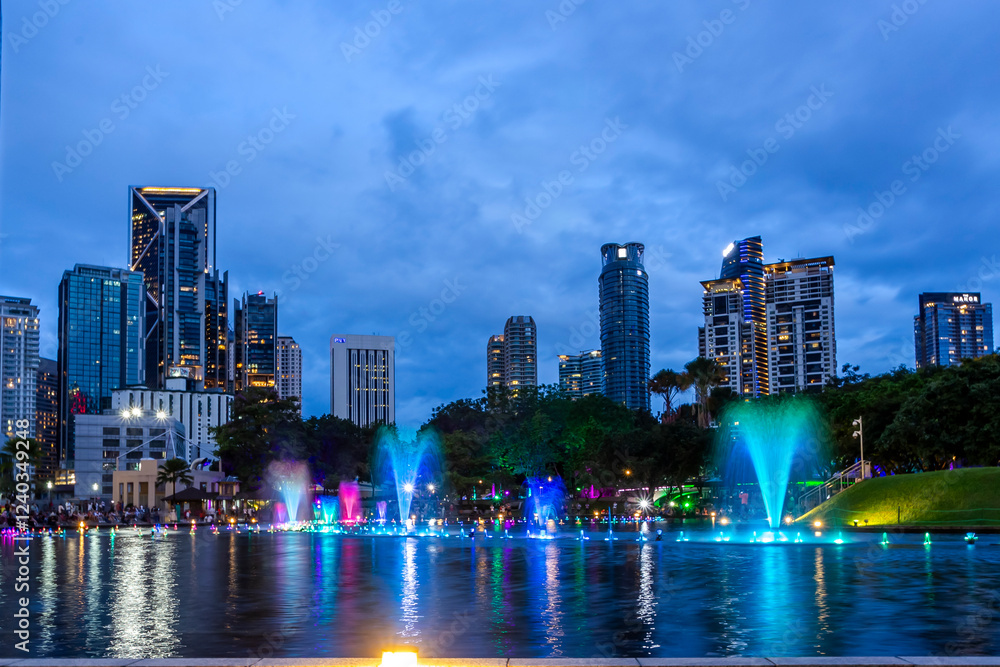 Obraz premium Beautiful light show near Petronas twin towers in Kuala Lumpur, Malaysia