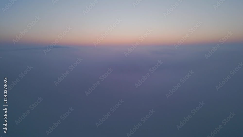 Aerial drone view above clouds at sunrise, high-altitude misty landscape with rolling fog and golden horizon, breathtaking cinematic aerial footage capturing the tranquil beauty of sky and clouds in Aerial drone view above clouds at sunrise, high-altitude misty landscape with rolling fog and golden horizon, breathtaking cinematic aerial footage capturing the tranquil beauty of sky and clouds in