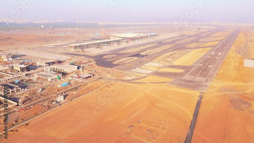 Drone shot unfinished airport site with multiple airstrips