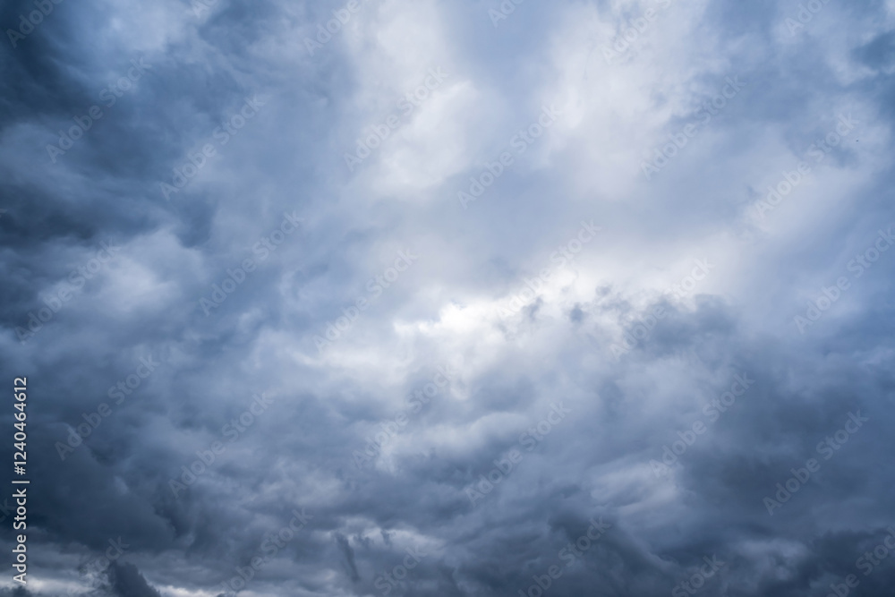 Experience a dramatic view with a turbulent sky overhead, dark gray clouds signaling imminent weather changes, enhancing the landscapes intensity in a captivating scene that demands admiration Experience a dramatic view with a turbulent sky overhead, dark gray clouds signaling imminent weather changes, enhancing the landscapes intensity in a captivating scene that demands admiration