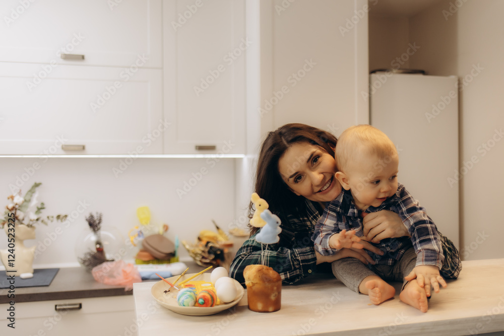 Mother and Baby Smiling Together in a Bright Modern Kitchen Mother and Baby Smiling Together in a Bright Modern Kitchen