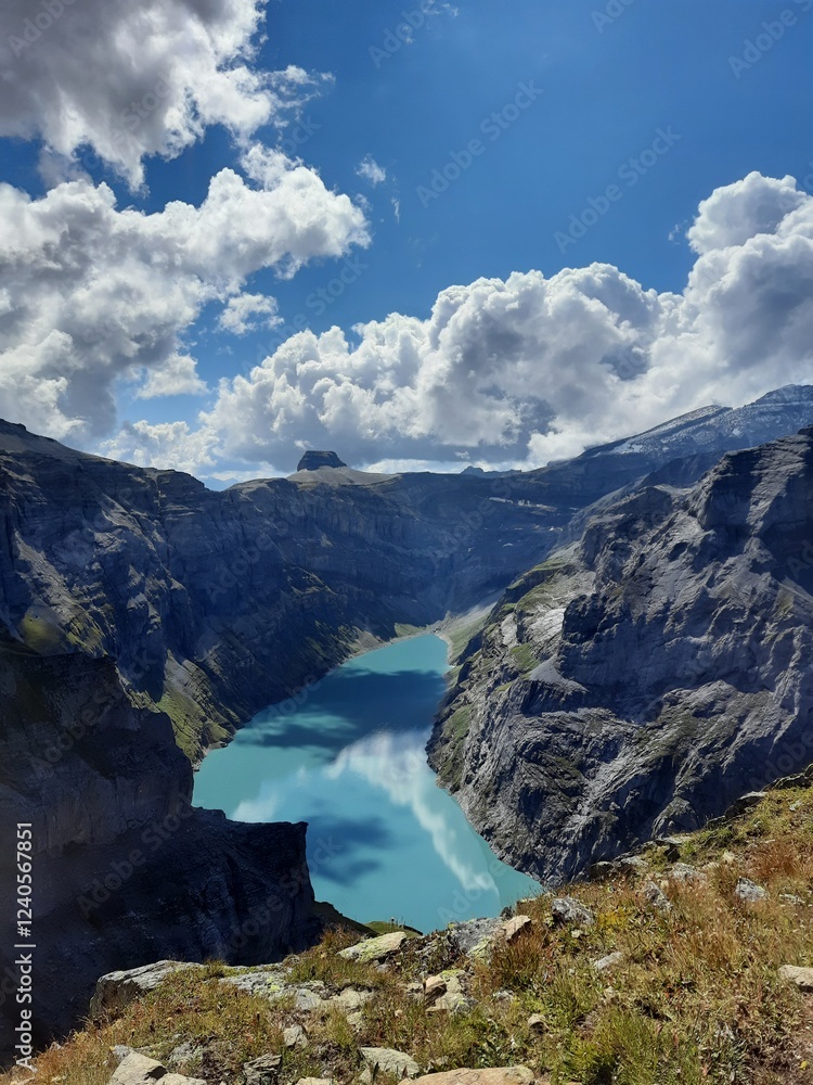 Fototapeta premium Magic photo of a lake reflecting the mountains during a hike in the Swiss Alps
