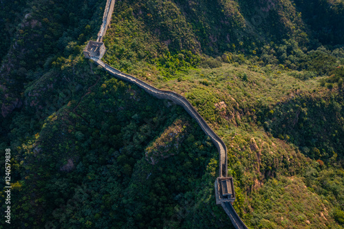 Aerial view of the winding Jinshanling Great Wall amidst beautiful mountains and forests, Luanping County, China. photo