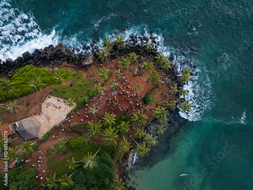 Aerial view of Parrot rock surrounded by scenic beach and turquoise ocean, Mirissa, Sri Lanka.