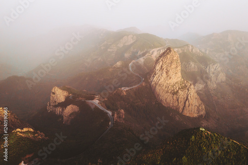 Aerial view of majestic rock formations and rugged mountains in a tranquil valley, Hermigua, Santa Cruz de Tenerife, Spain. photo