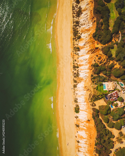 Aerial view of beautiful Praia de Falesia beach with scenic cliffs and turquoise ocean, Olhos de Agua, Portugal. photo