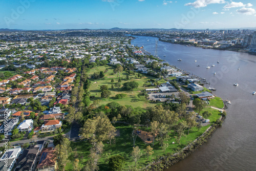 Aerial view of Brisbane River with Bulimba Golf Club and Vic Lucas Park surrounded by greenery and residential areas, Bulimba, Australia. photo