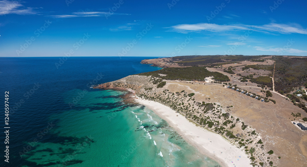 Aerial view of serene Stokes Bay Beach with pristine sandy shore and blue ocean waves, Stokes Bay, Australia. Aerial view of serene Stokes Bay Beach with pristine sandy shore and blue ocean waves, Stokes Bay, Australia.