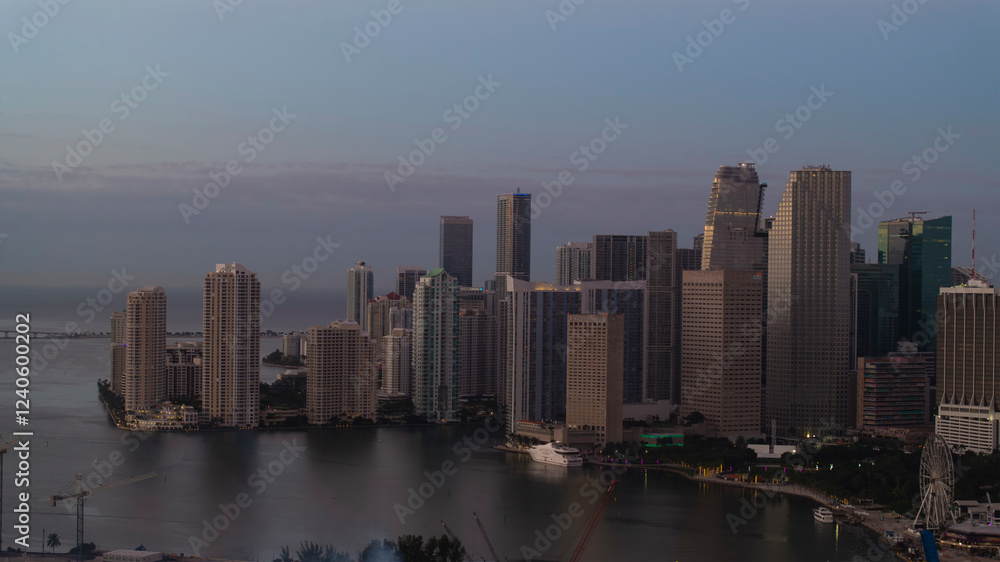 Aerial view of skyline with skyscrapers and a cruise ship in Biscayne Bay at sunset, Watson Island, United States. Aerial view of skyline with skyscrapers and a cruise ship in Biscayne Bay at sunset, Watson Island, United States.
