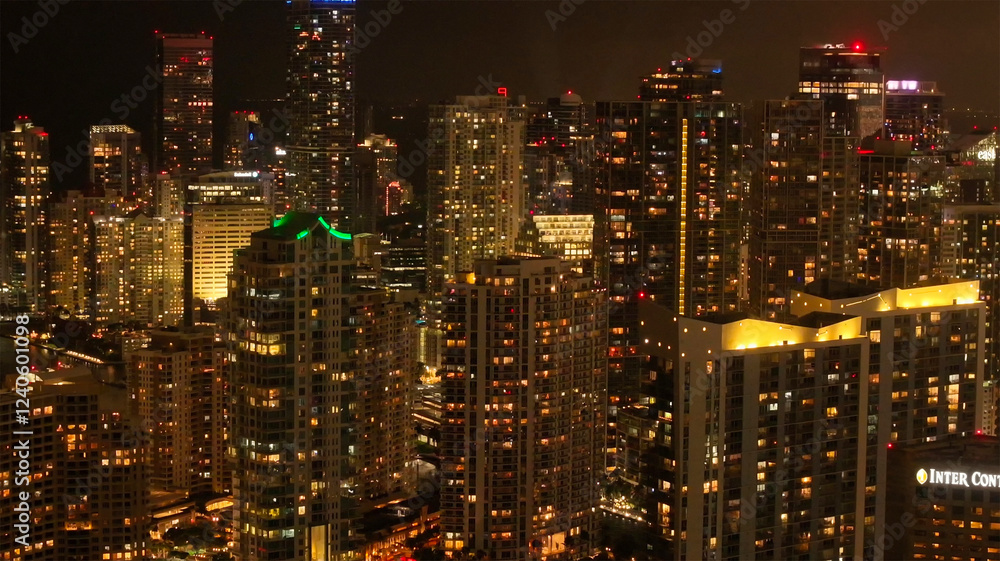 Aerial view of vibrant city lights and illuminated skyscrapers in downtown, Miami, United States. Aerial view of vibrant city lights and illuminated skyscrapers in downtown, Miami, United States.