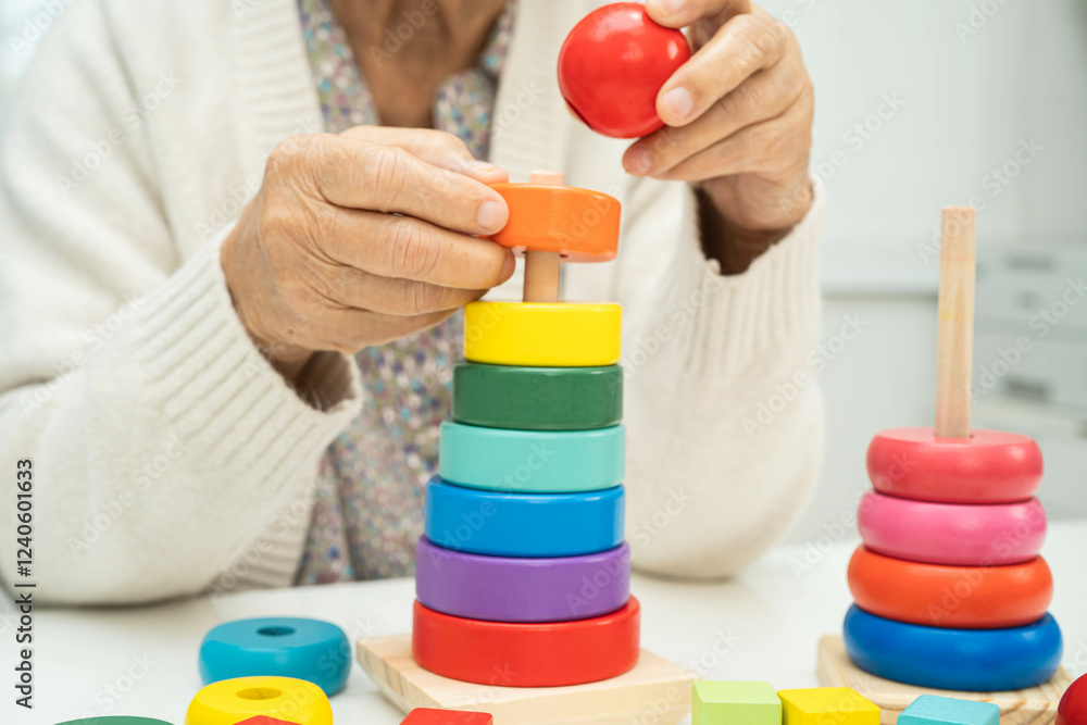 Asian elderly woman playing enhancing skill board game. Asian elderly woman playing enhancing skill board game.