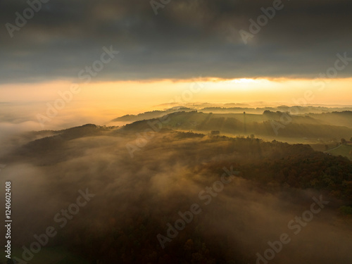 Wallpaper Mural Aerial view of beautiful sunrise over foggy mountains and serene landscape, Bad Loipersdorf, Austria. Torontodigital.ca
