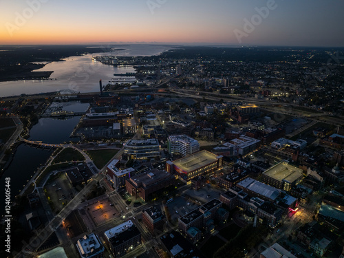 Aerial view of beautiful Providence cityscape at sunrise with city lights reflecting on the river, Providence, United States.
