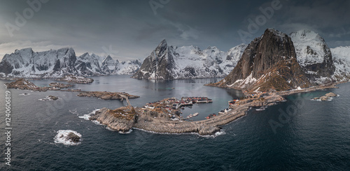 Aerial view of picturesque hamnoy with snowy mountains and tranquil sea, Reine, Norway. photo