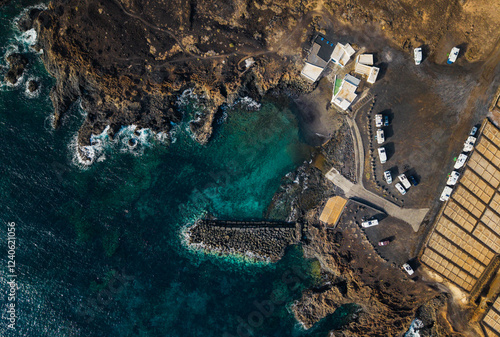 Aerial view of scenic coastline with salt flats and rugged cliffs, Teguise Town, Lanzarote Island, Spain. photo