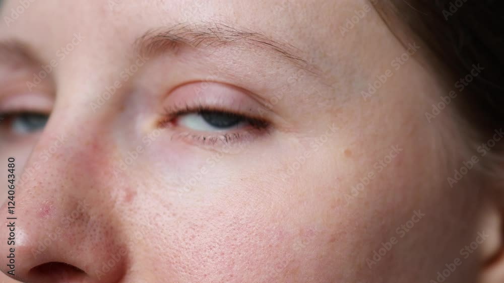Close-up view of a person's eye highlighting natural beauty and features in soft lighting Close-up view of a person's eye highlighting natural beauty and features in soft lighting