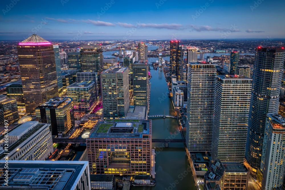 Fototapeta premium The office and residential skyscrapers at the financial district Canary Wharf, London, during evening