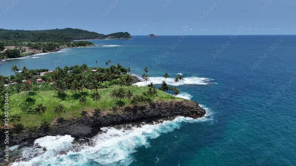 Sao Tome and Principe - Boca do Inferno Aerial View. Dramatic Coastal Cliffs and Palm-Lined Shoreline With Crashing Ocean Waves. Sao Tome and Principe - Boca do Inferno Aerial View. Dramatic Coastal Cliffs and Palm-Lined Shoreline With Crashing Ocean Waves.