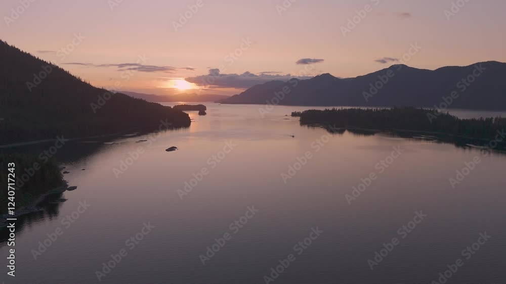 Aerial view of serene sunset over tranquil water and majestic mountains, Sitka, United States.