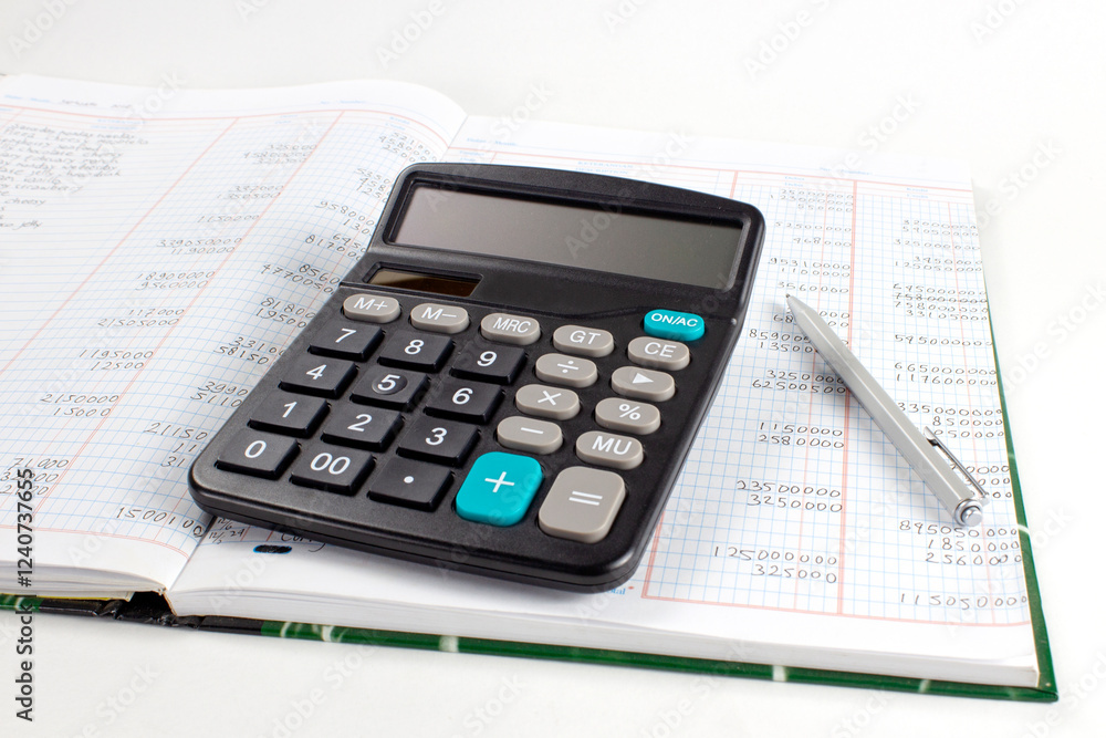 Calculator on top of financial report and stationery on desk. Accounting and auditing business concept. Calculator on top of financial report and stationery on desk. Accounting and auditing business concept.
