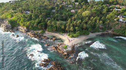 A rotating drone flight at one of the most beautiful beaches in Weligama, Sri Lanka. Golden hour.