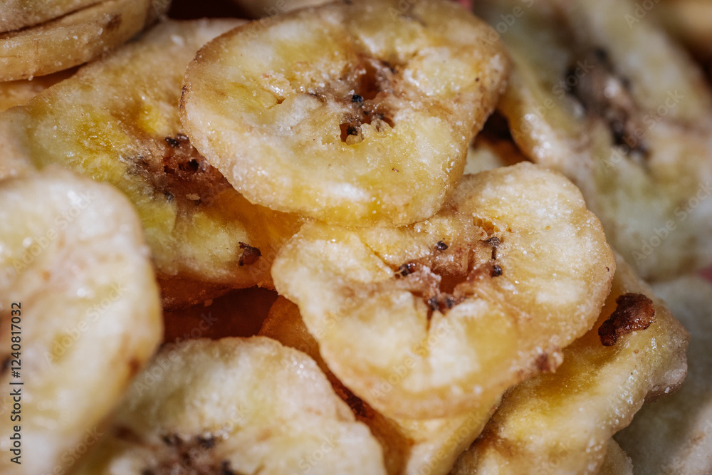 Macro shot of freeze-dried banana chips, highlighting their crunchy texture and golden yellow color. Perfect for food, snacks, and healthy eating themes. Macro shot of freeze-dried banana chips, highlighting their crunchy texture and golden yellow color. Perfect for food, snacks, and healthy eating themes.