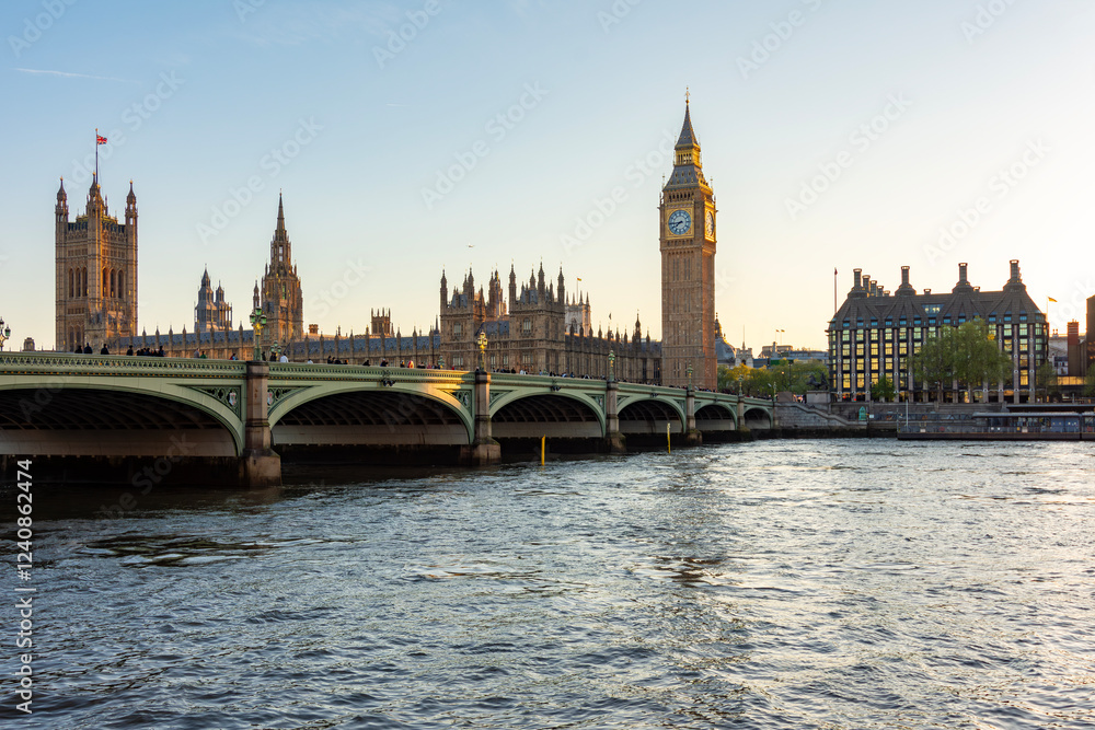 Naklejka premium Houses of Parliament with Big Ben tower and Westminster bridge at sunset, London, UK