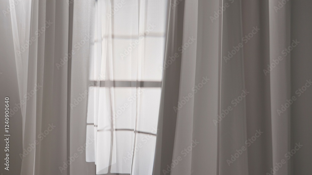 Transparent white silk curtains in daylight floating from an open window, shadows from window frame reflected on the textile. Transparent white silk curtains in daylight floating from an open window, shadows from window frame reflected on the textile.