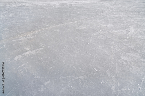 hockey puck and ice on the scratches surface abstract background ice arena photo