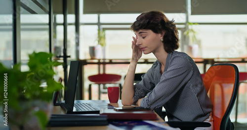 Obraz na plátne Young adult gen z woman lady sitting use laptop do over work time look screen fe