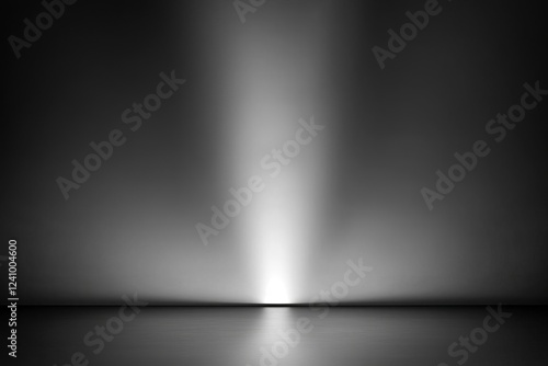 Dark black and gray blurred background has a little abstract light