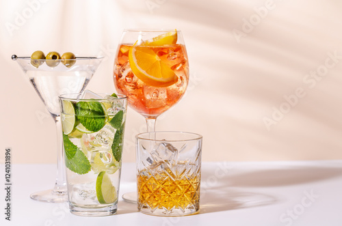 A vibrant display of cocktails, including Aperol Spritz, Mojito, and Martini