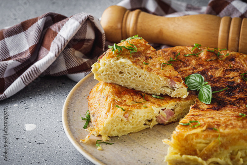 traditional Italian omelet with spaghetti frittata on a stone rustic background