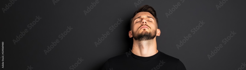 Fototapeta premium Man contemplating the sky portrait of peace and mindfulness in nature