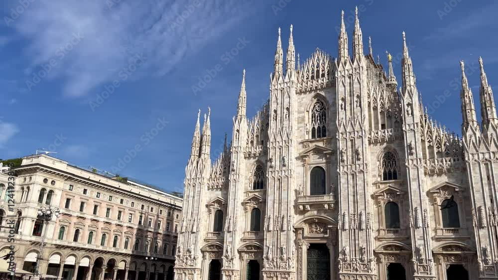 Panoramic view of Vittorio Emanuele II Gallery and Milan Cathedral in town square on sunny day. European landmark, tourism attraction in Italy concepts Panoramic view of Vittorio Emanuele II Gallery and Milan Cathedral in town square on sunny day. European landmark, tourism attraction in Italy concepts