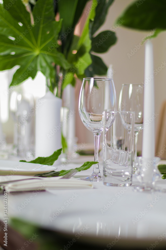 Festive table decorations, flowers and tableware, beautiful table setting for guests Festive table decorations, flowers and tableware, beautiful table setting for guests