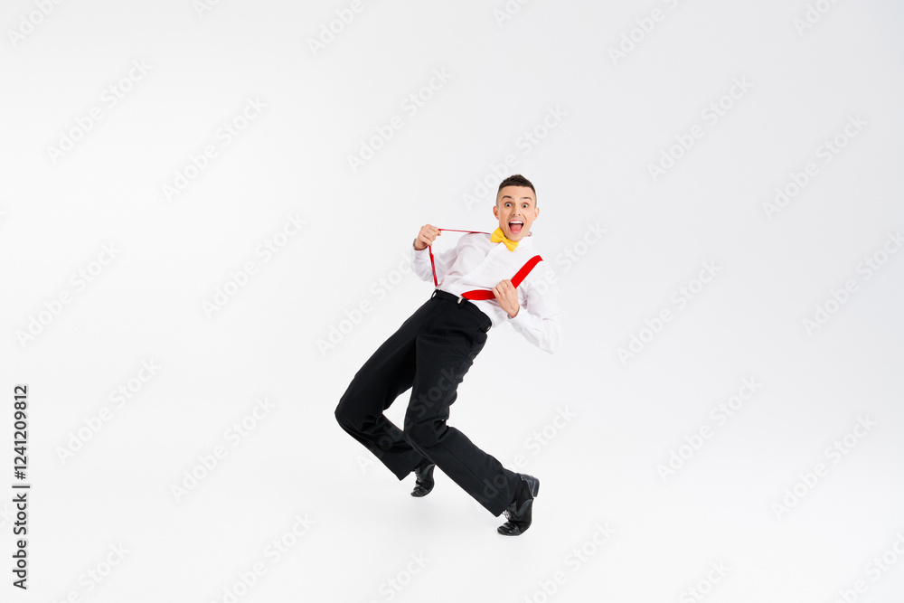 Full body portrait of funny elegant young man pull suspenders dance isolated on white color background Full body portrait of funny elegant young man pull suspenders dance isolated on white color background