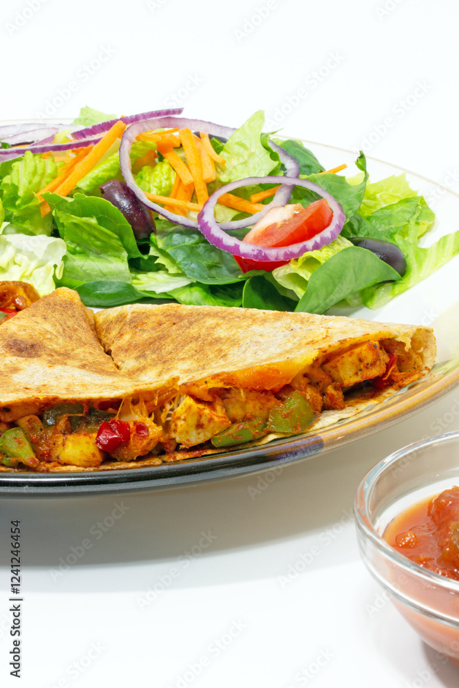 Quesadilla, Mediterranean salad, salsa and sour cream Mexican style food plate Quesadilla, Mediterranean salad, salsa and sour cream Mexican style food plate